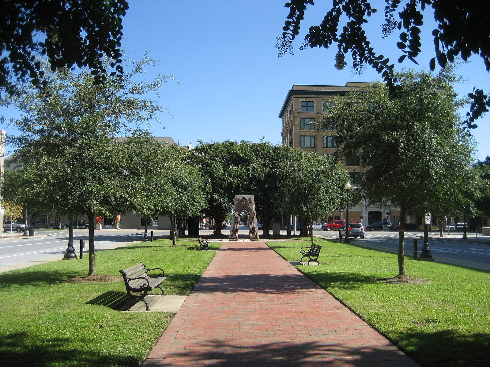 Palafox Street and a tree-lined park in downtown Pensacola